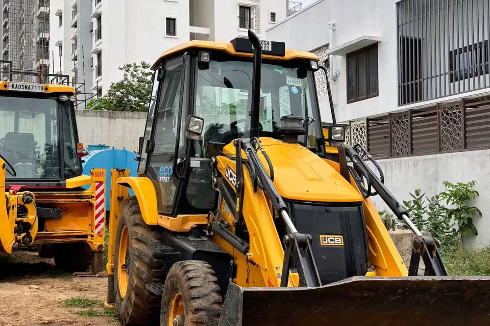 Backhoe loader at urban construction site